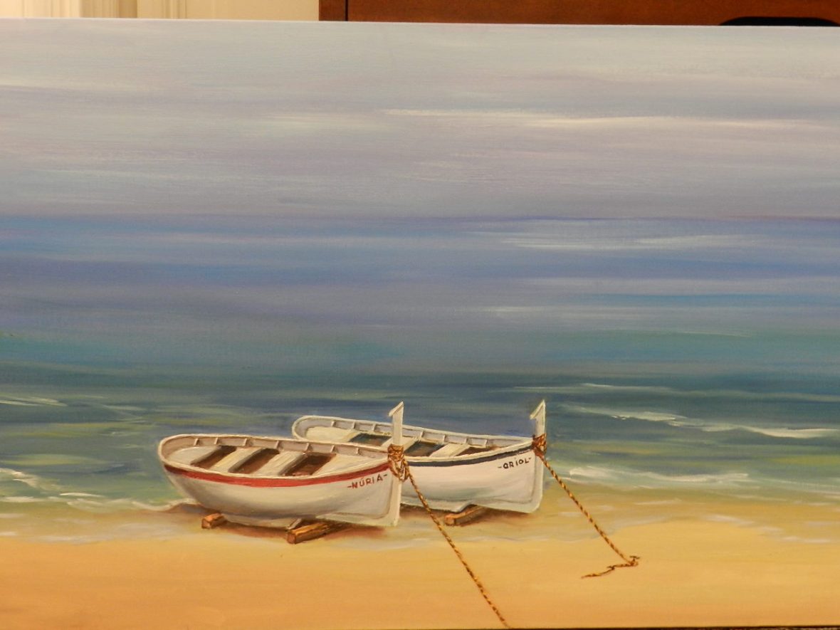 Quadre de Pepita Manzanares de dues barques de pescadors i la platja